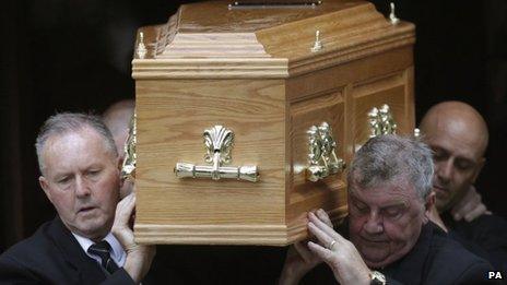 David McLetchie's coffin is carried from the church