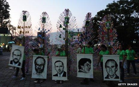 Catholic faithful march with photos of the priests at University in San Salvador, El Salvador, 2009