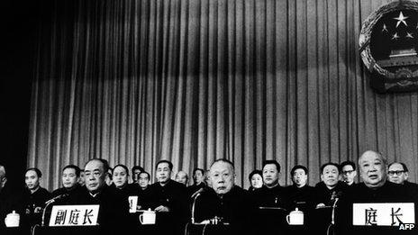 Special Court President Jiang Hua (R) reads the verdict during the Gang of Four trial on 26 January 1981 in Beijing. Mao Zedong's widow Jiang Qing and Zhang Chunqiao received death sentences that were later commuted to life imprisonment, while Wang Hongwen and Yao Wenyuan were given life and 20 years in prison, respectively. They were all later released.