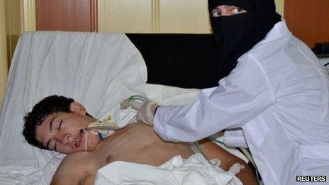 A youth, affected by what activists say is toxic gas, is treated at a hospital in the Duma neighbourhood of Damascus August 21, 2013