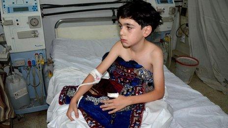 A boy, affected by what activists say is nerve gas, is treated at a hospital in the Duma neighbourhood of Damascus August 21, 2013