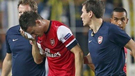 Arsenal defender Laurent Koscielny walks off after suffering his injury against Fenerbahce