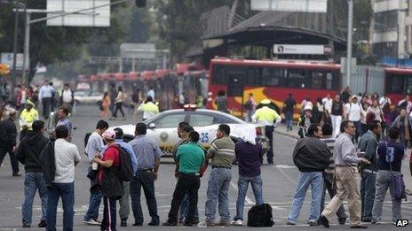 Teachers block Reforma Avenue, near Senate chambers, in Mexico City, Tuesday, Aug 20