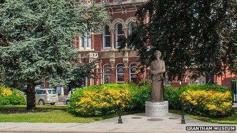 Baroness Thatcher is standing in two of the statues - with one on a low plinth and the other on a higher one