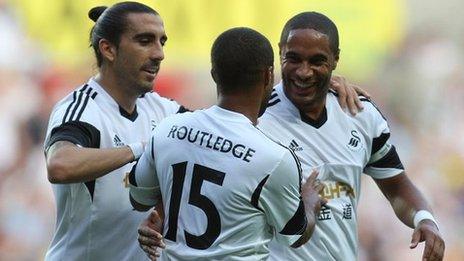 Wayne Routledge gets the Swansea congratulations