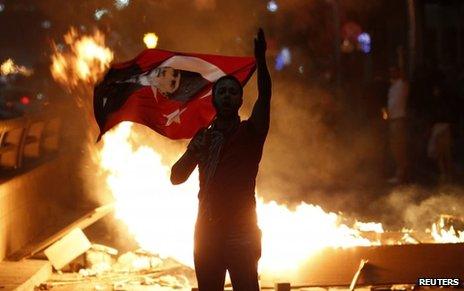 Anti-government protester with Turkish flag with portrait of Ataturk