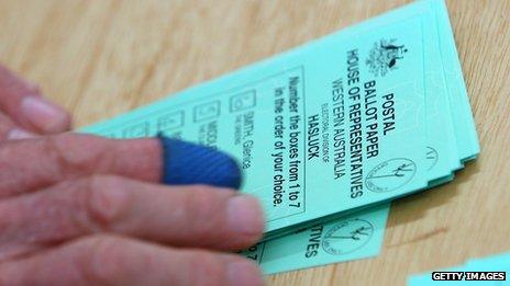 File photo: A ballot paper is scrutinised as the counting of absentee and postal votes for the marginal seat of Hasluck, Western Australia 25 August 2010 in Perth, Australia