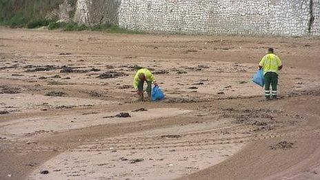 Beach cleaners on a beach in Thanet