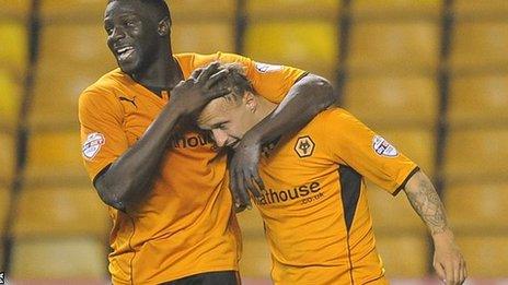 Leigh Griffiths (right) is embraced by Bakary Sako