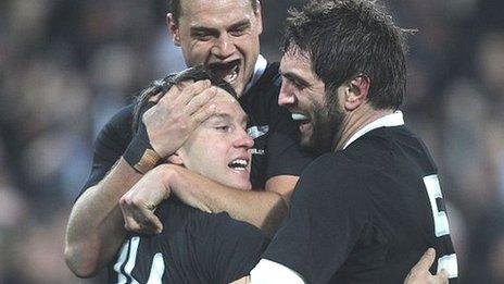 Israel Dagg (top) and Sam Whitelock (right) congratulate New Zealand try-scorer Ben Smith