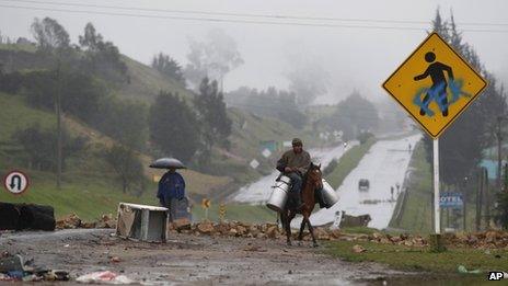 A man carries milk on a horse in Ventaquemada, Boyaca on 23 August 2013