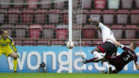 Kevin McHattie tackles Calvin Zola