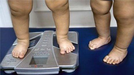 Children's feet on weighing scale