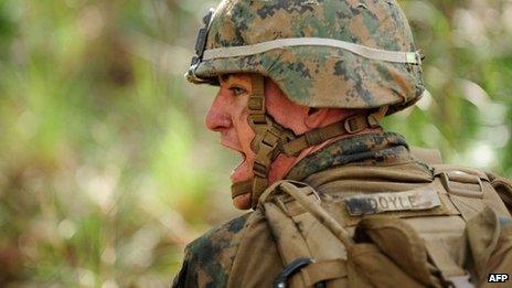 A US Marine yells out to his fire support squad while participating in a live fire exercise on 31 July 2013 near Rockhampton, Australia