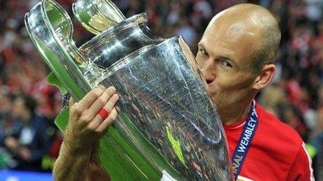 Bayern Munich winger Arjen Robben kisses the Champions League trophy after