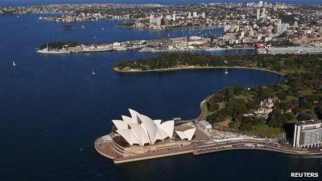 The Sydney Opera House is seen in front of some of the eastern suburbs on a sunny winter afternoon in Sydney, 24 August 2013