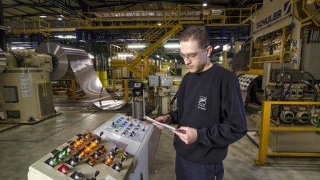 A worker in Ball Packaging's Belgrade canning plant