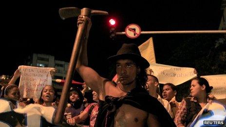 A man takes part in a demonstration in support of striking farmers in Cali on 26 August 2013