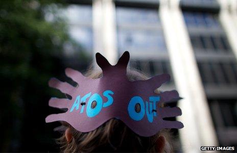 A protester outside the Atos building