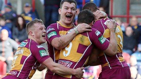 Huddersfield Giants players celebrate a try in the win against Leeds