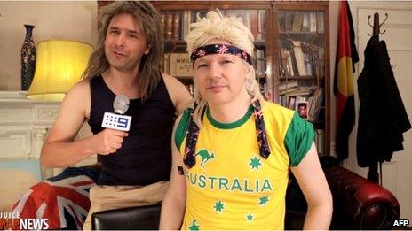 This screen grab taken on 27 August 2013 from video received from www.thejuicemedia.com in Australia shows Wikileaks founder Julian Assange, right, taking part in a musical spoof on his Australian political party for cult web series Rap News