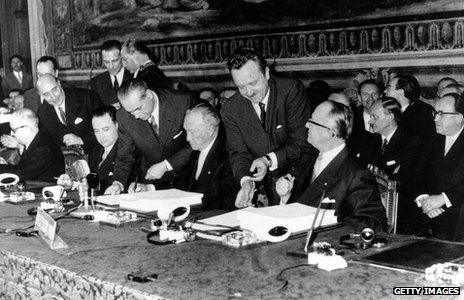 1957 - delegation members sign the Treaty of Rome
