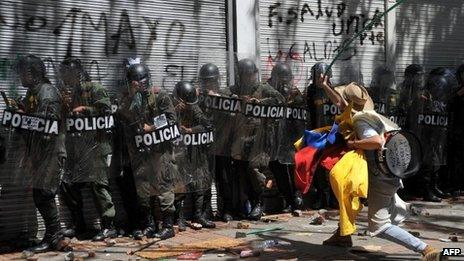 Protester confronts police in Bogota. 29 Aug 2013