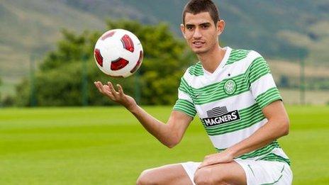 Israel midfielder Nir Biton poses in his new Celtic kit