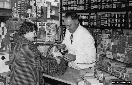 A customer buys products from a local grocer