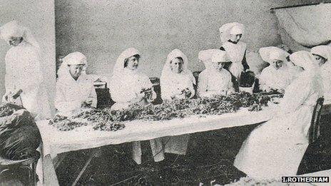 Women in North America sorting through collection of dried sphagnum moss (Image courtesy of Prof Ian Rotherham)