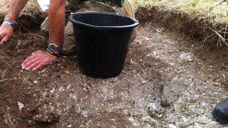 A dig begins to remove the wreckage of a WW2 Spitfire on Salisbury Plain