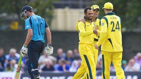 Scotland's Calum MacLeod is put out by Fawad Ahmed (2nd left).