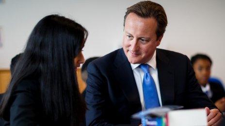 Prime Minister David Cameron with a student (pic: AFP/Getty Images)