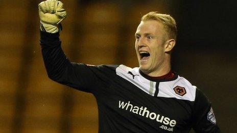 Wolves keeper Aaron McCarey celebrates one of his two penalty saves against his old club Walsall