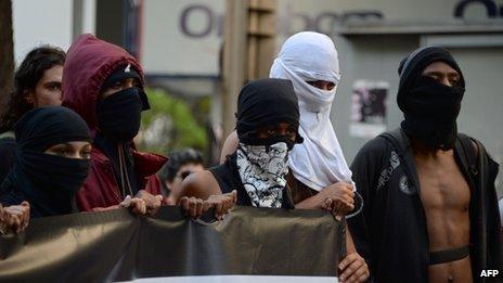 Demonstrators during a march against corruption in Rio de Janeiro on 21 August, 2013