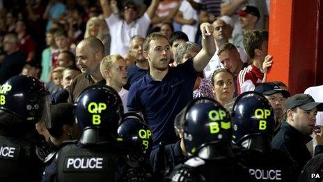 Bristol City fans are separated from Bristol Rovers fans by police