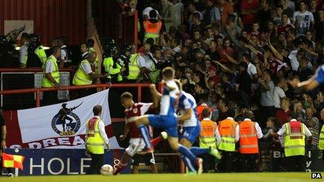 Police and stewards separating fans in the stands at Ashton Gate