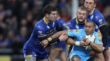 Kevin Penny is surrounded by three Leeds players