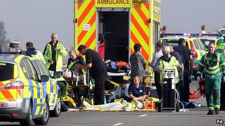 Paramedics treat people at the scene