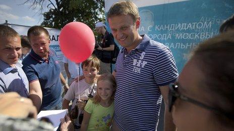 Alexei Navalny, centre, poses for a photo in downtown Moscow on 21 August.