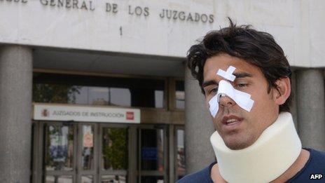 Thomas Drouet leaves a court house bandaged and wearing a neck brace in Madrid on 6 May 2013.