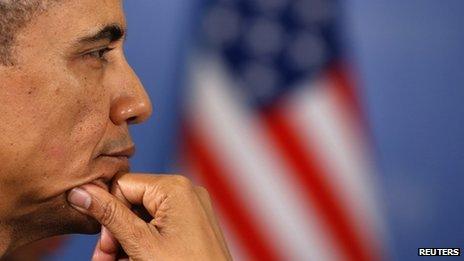 US President Barack Obama sits in front of an American flag at the G20 Summit in St. Petersburg on 6 September 2013