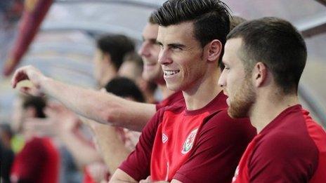 Gareth Bale looks on from the sidelines