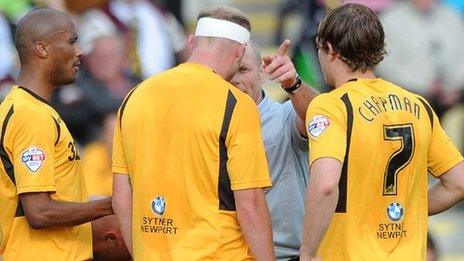 Referee Dave Phillips sends off Lee Minshull of Newport County
