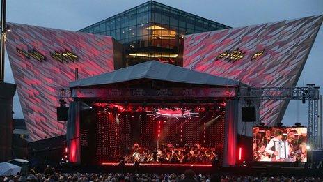 View of stage with Titanic Belfast in background