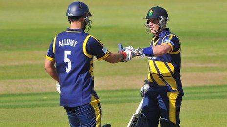 Jim Allenby is congratulated on reaching his 50 by batting partner Ben Wright during Glamorgan's win over Hampshire