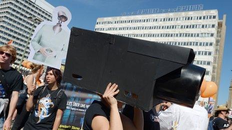 In this picture taken 7 September, 2013, a woman protests with a self-made surveillance camera on her head during the demonstration "in Berlin, Germany.