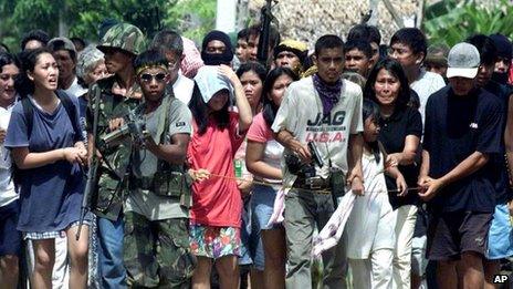 File photo: the MNLF uses hostages as a human shield in Zamboanga city on 27 November 2001