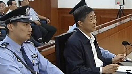 This screen grab taken from state television CCTV footage broadcast on 25 August 2013 shows ousted Chinese political star Bo Xilai (R) speaking in the courtroom as he stands trial at the Intermediate People's Court in Jinan, in eastern China's Shandong province