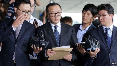 Chun Jae-Kook (C), eldest son of former South Korean President Chun Doo-hwan, speaks to the media at the Seoul Central District Prosecutors Office in Seoul on 10 September 2013